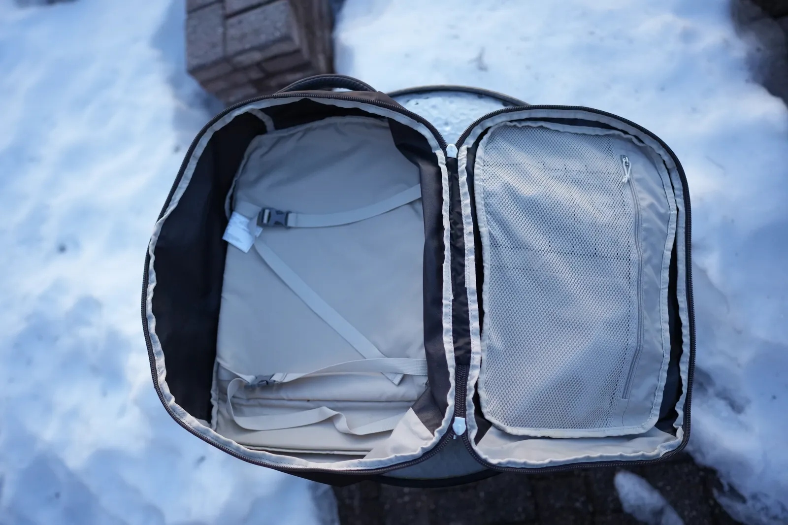 Osprey Daylite 35 main compartment fully open in clamshell style, showing internal compression straps and mesh divider pocket