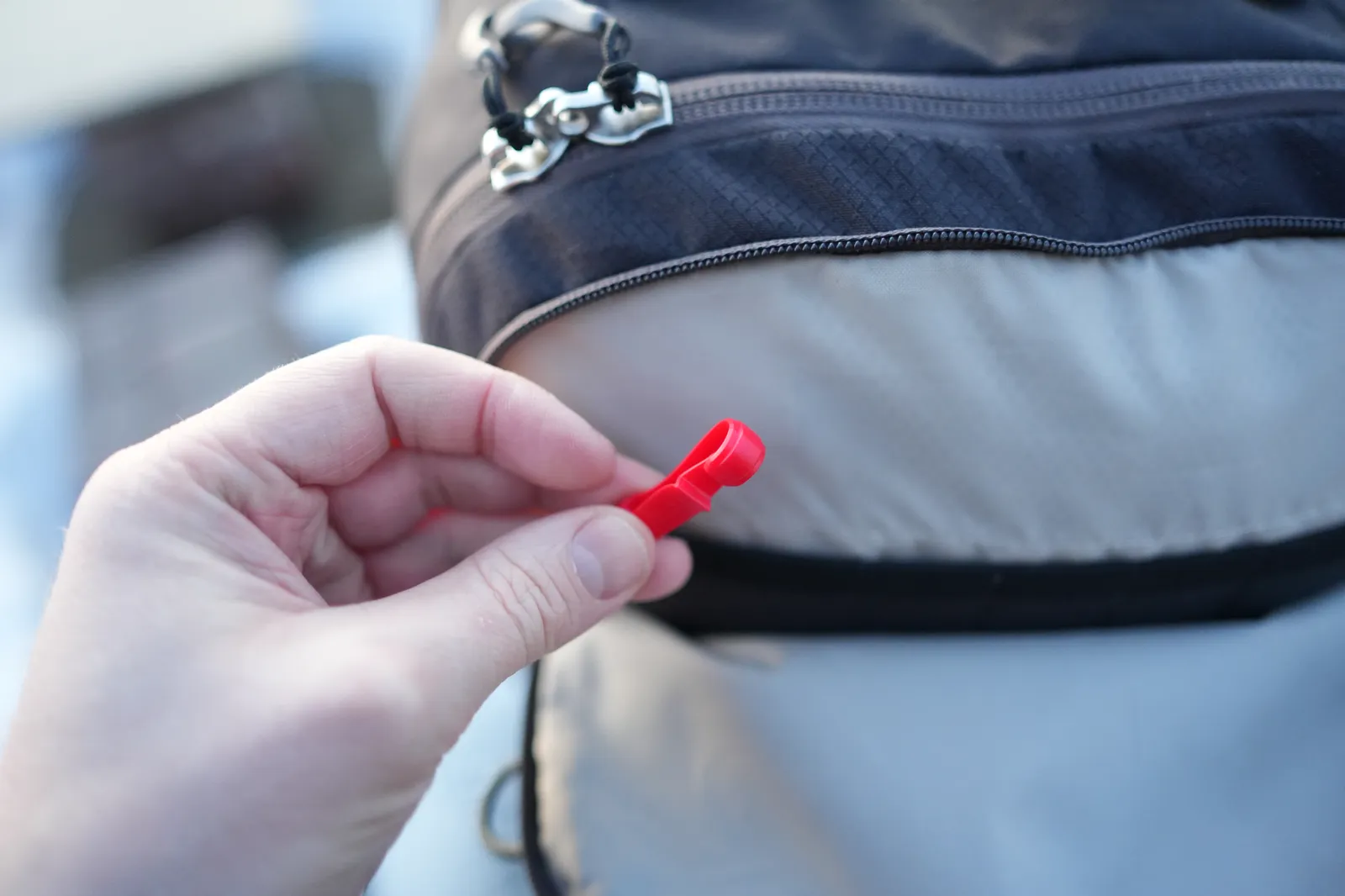 Close-up of the red key clip lanyard inside the Osprey Daylite 35 top pocket