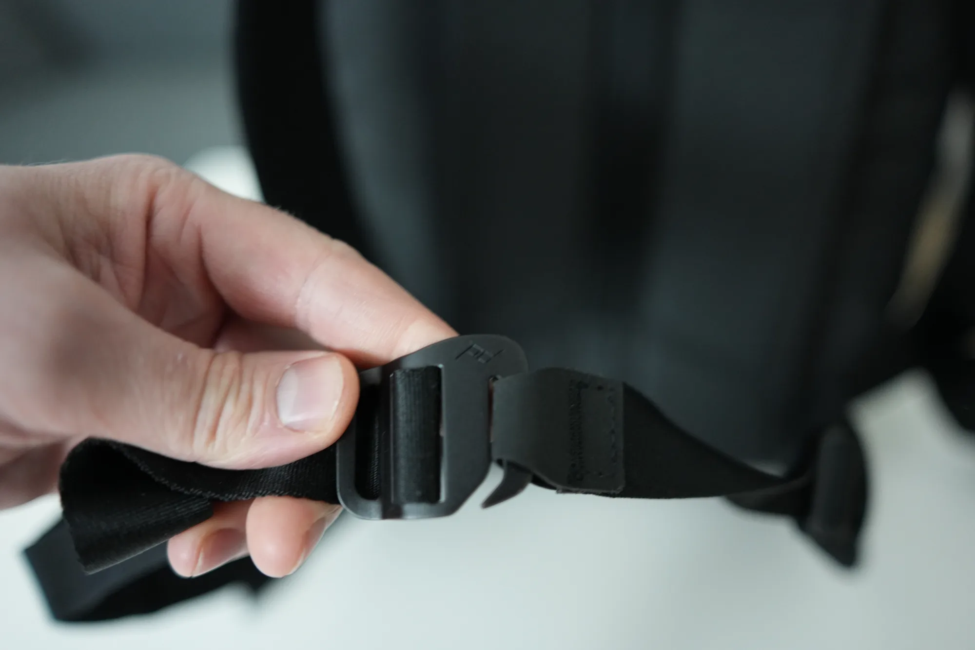 Peak Design hip belt buckle mechanism attached to backpack strap