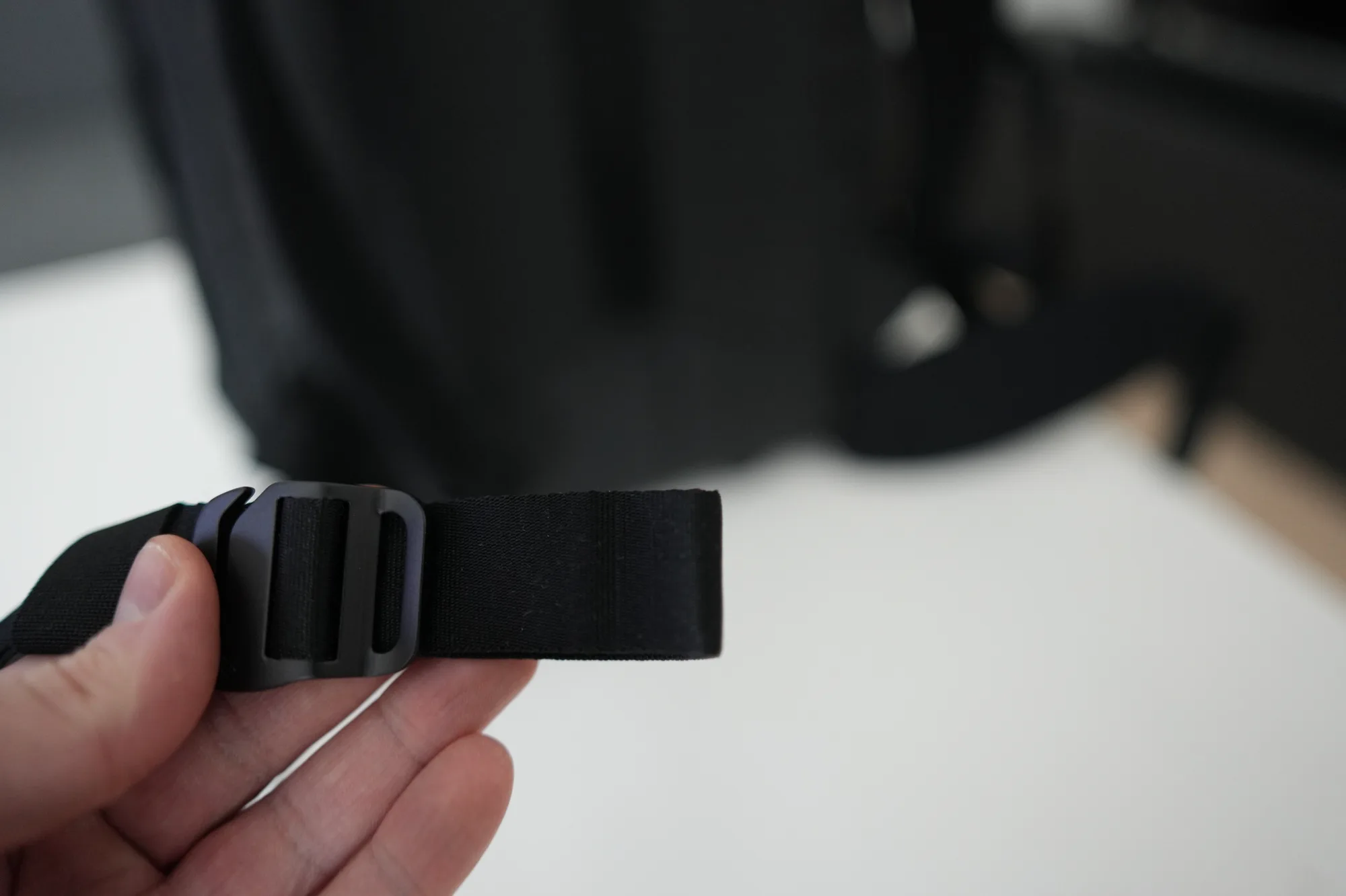 Close-up of Peak Design hip belt ladder lock buckle adjustment mechanism