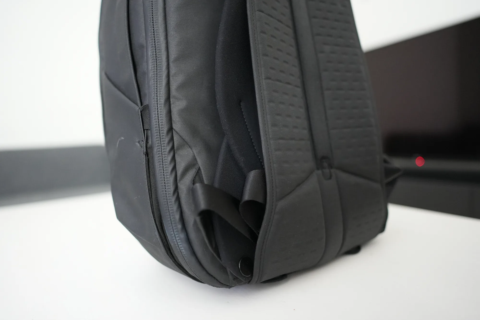Peak Design Travel Backpack 30L side view showing hip belt attachment point