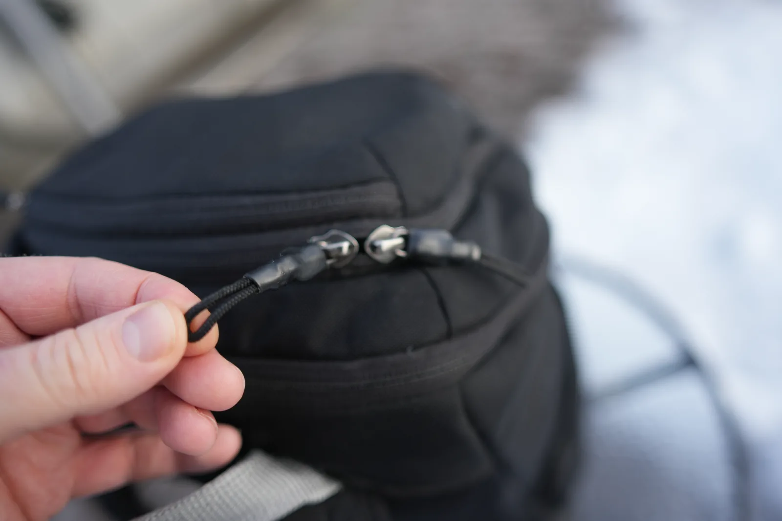 Thule Chasm 26L YKK zipper pulls close-up detail
