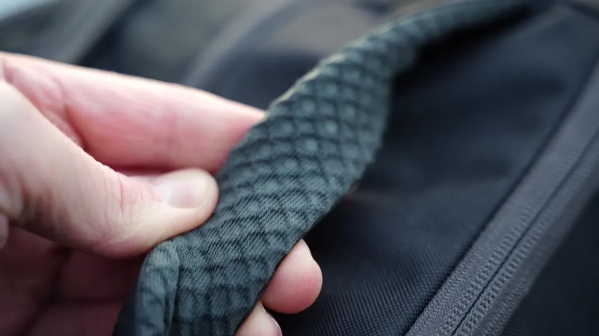Close-up of Osprey Daylite 26+6 shoulder strap padding and texture