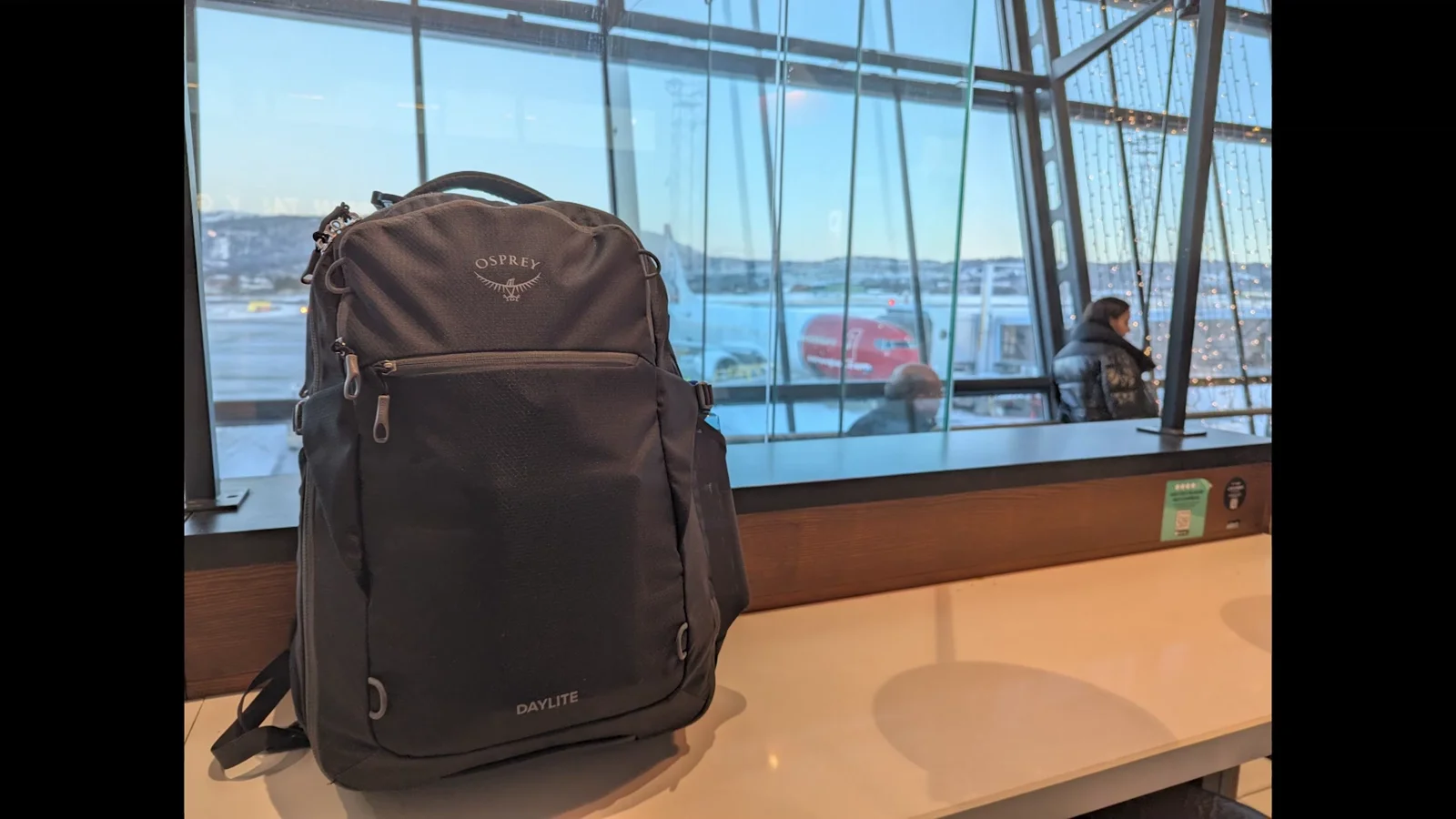 Osprey Daylite 35 at an airport terminal ready for carry-on travel